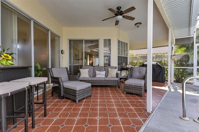 sunroom featuring ceiling fan