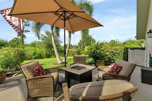 view of patio with an outdoor fire pit