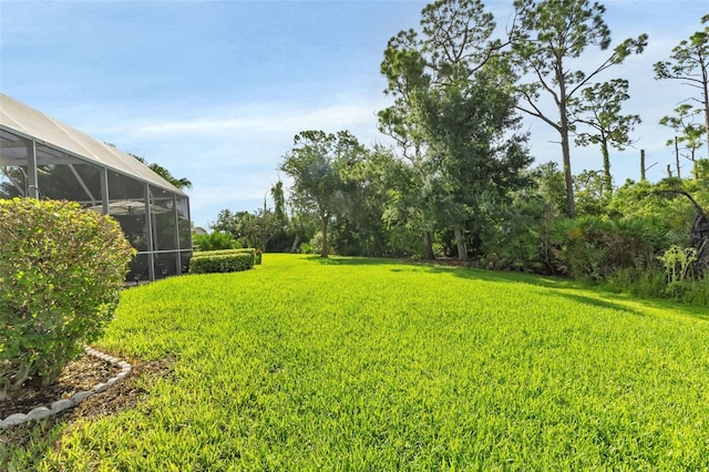 view of yard featuring a lanai