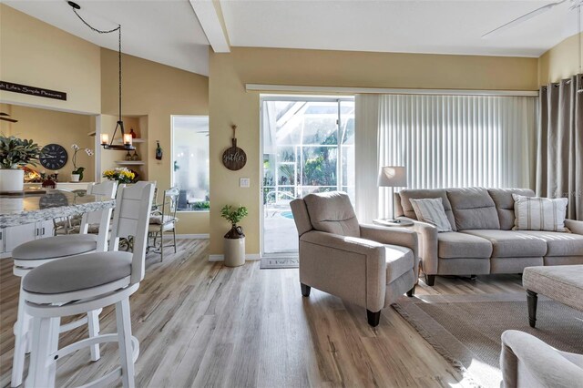 13791 Palmetto Point Ct, Port Charlotte, FL 33953 - living area with baseboards, lofted ceiling, and light wood finished floors