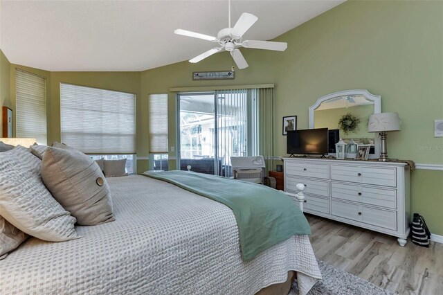 13791 Palmetto Point Ct, Port Charlotte, FL 33953 - bedroom featuring baseboards, ceiling fan, wood finished floors, and vaulted ceiling