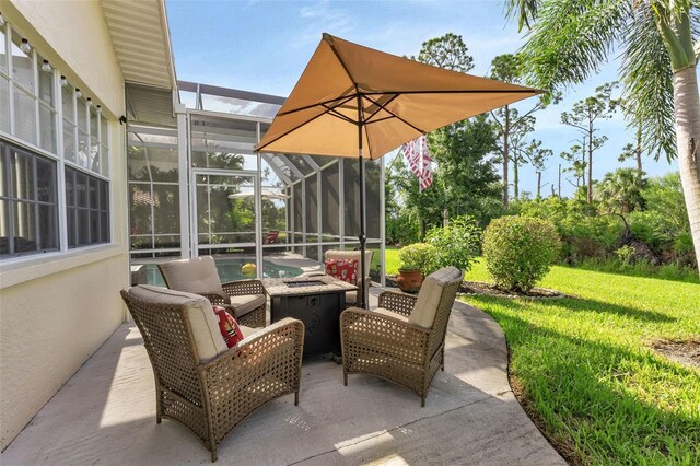 13791 Palmetto Point Ct, Port Charlotte, FL 33953 - view of patio / terrace with glass enclosure, an outdoor pool, and an outdoor fire pit