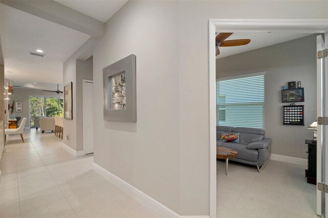 hallway featuring light tile patterned floors