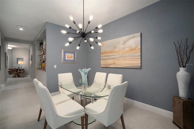 tiled dining room featuring a notable chandelier