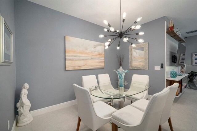 tiled dining area with an inviting chandelier