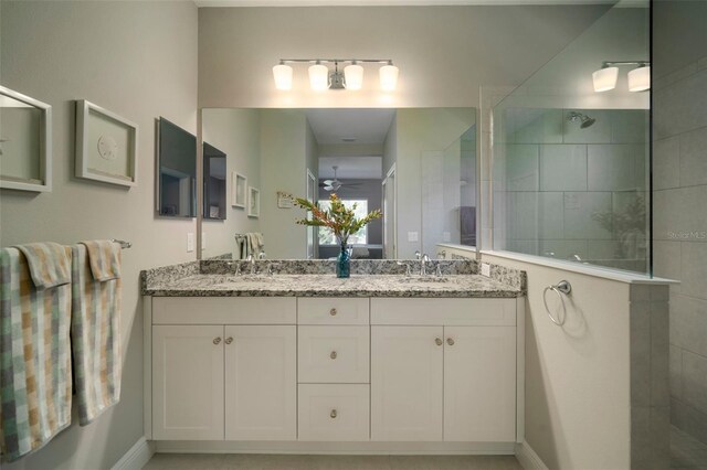 bathroom with dual vanity and ceiling fan