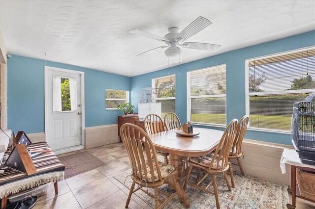 dining room featuring light tile patterned floors and ceiling fan