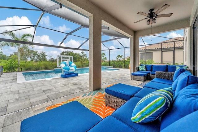 view of patio with ceiling fan, an outdoor living space, and glass enclosure