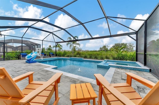 view of swimming pool with a lanai, a patio, pool water feature, and an in ground hot tub