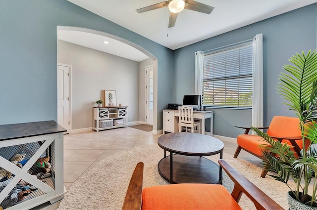 tiled living room featuring ceiling fan