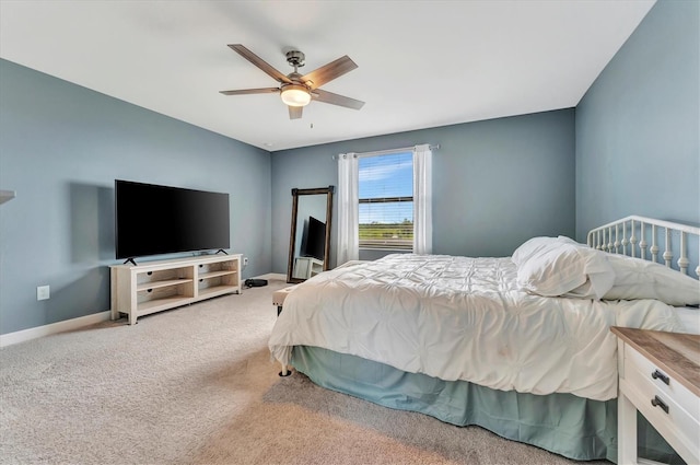 bedroom with ceiling fan and carpet flooring