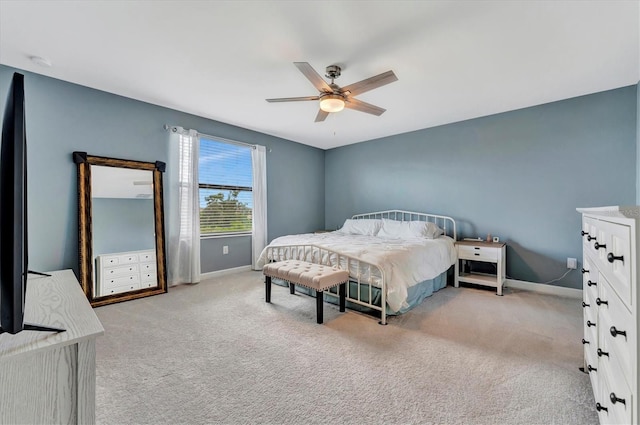 bedroom with light carpet and ceiling fan