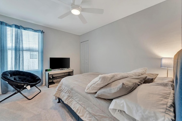 carpeted bedroom with ceiling fan