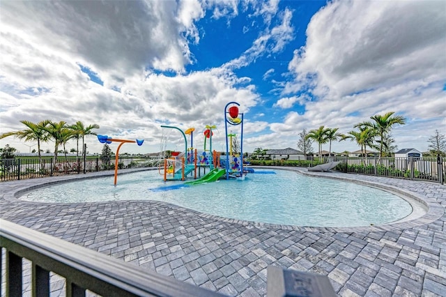 view of pool featuring a playground