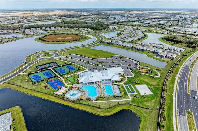 birds eye view of property with a water view