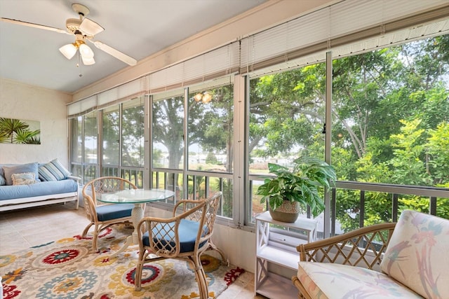 sunroom featuring ceiling fan