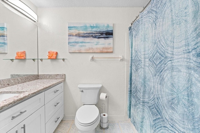 bathroom featuring vanity, toilet, and tile patterned floors