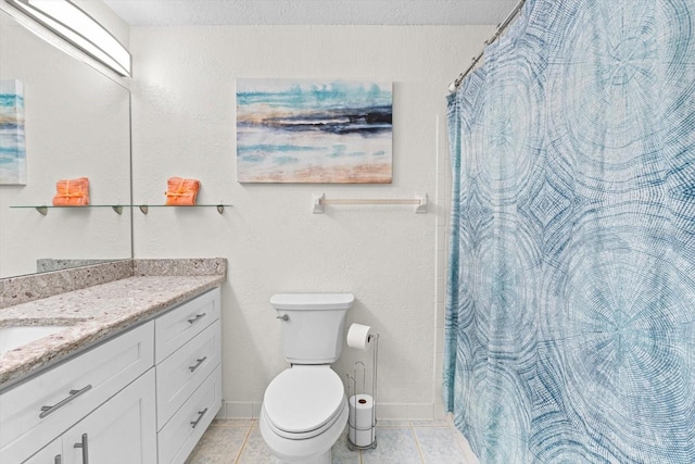 bathroom featuring baseboards, vanity, toilet, and tile patterned floors