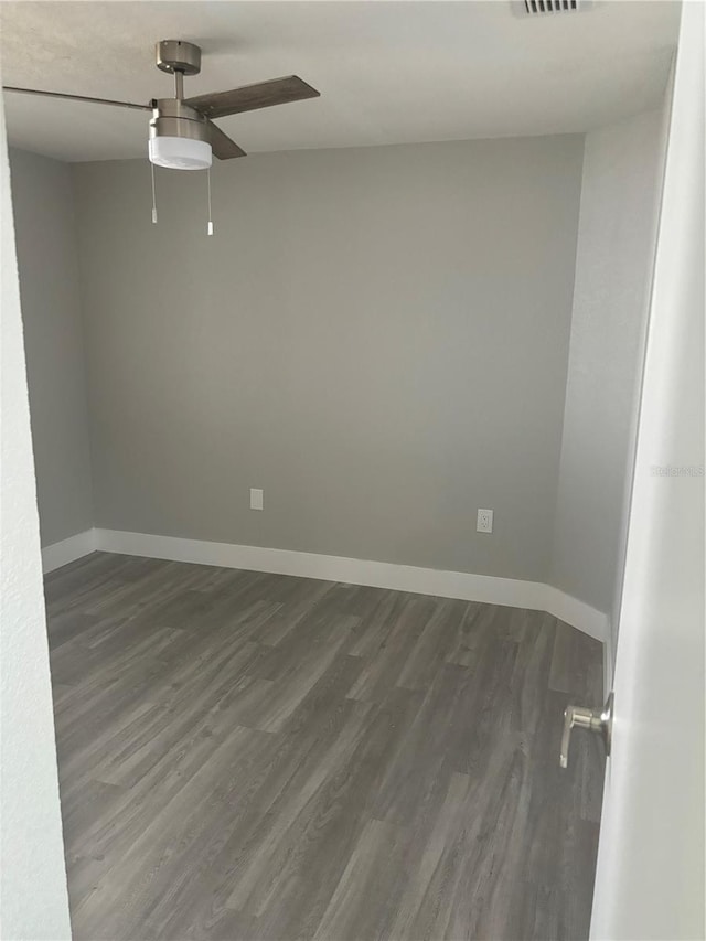 empty room featuring ceiling fan and hardwood / wood-style floors