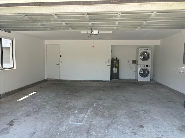 garage with a garage door opener, stacked washer / dryer, and electric water heater