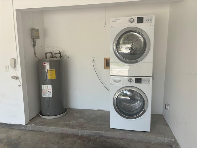 clothes washing area featuring electric water heater and stacked washer / dryer