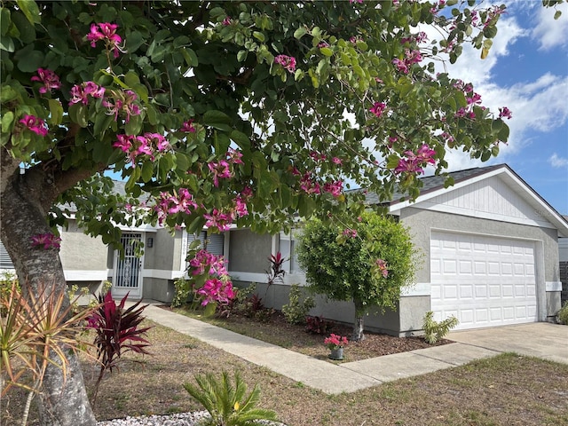 single story home featuring a garage