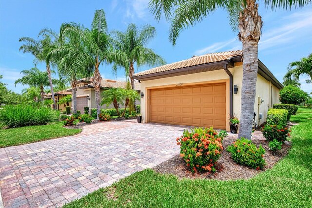 mediterranean / spanish-style house featuring a garage