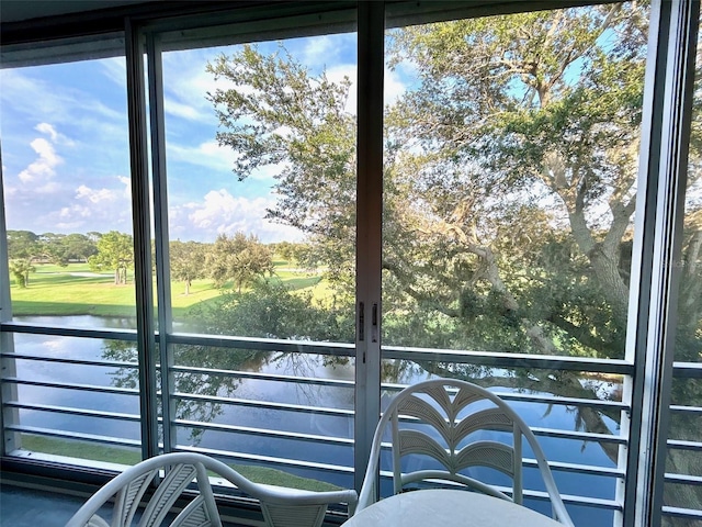 balcony featuring a water view