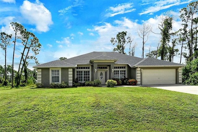 view of front of home with a garage and a front yard