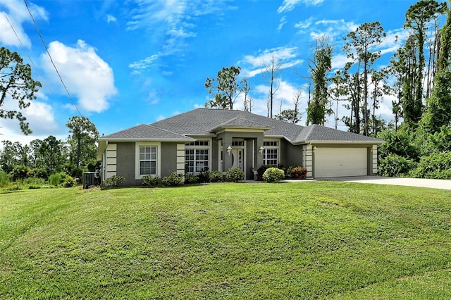 view of front of home featuring a front yard, cooling unit, and a garage