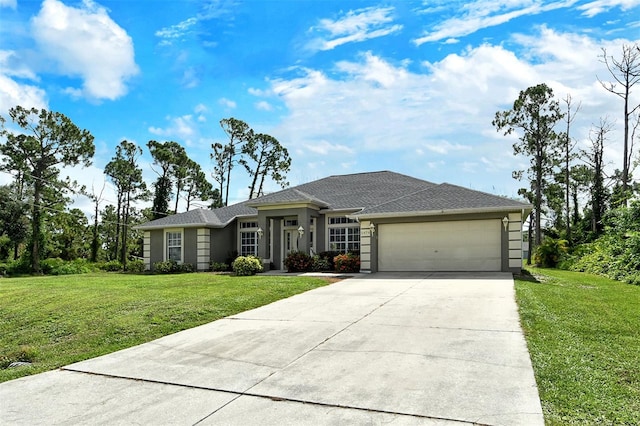 view of front of house featuring a garage and a front yard