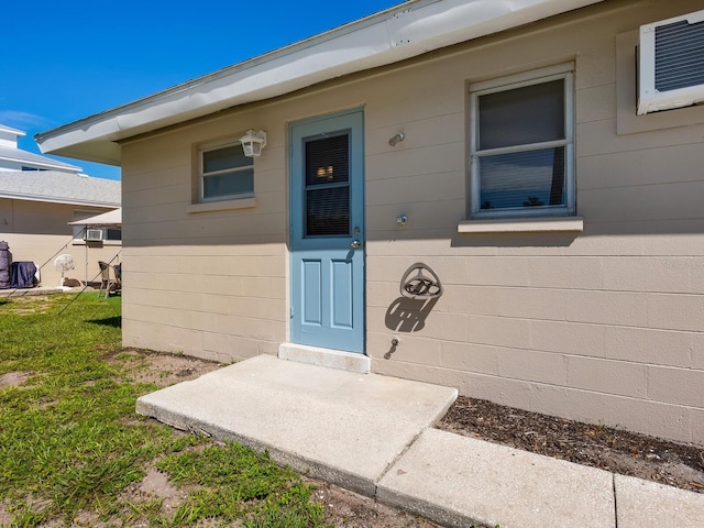 property entrance with a wall mounted AC