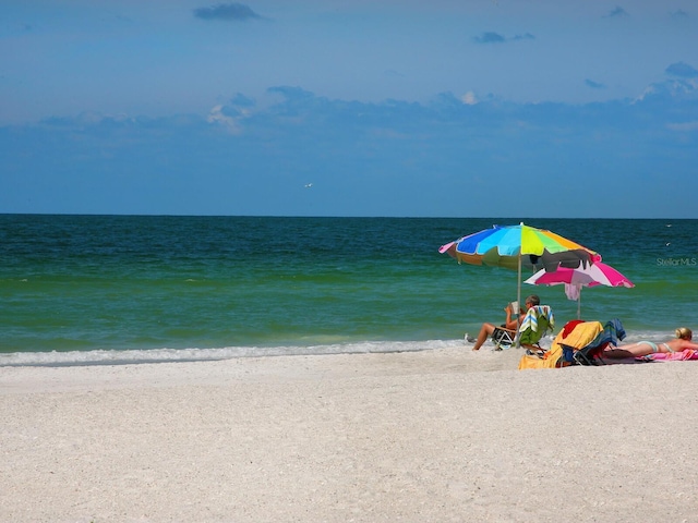 property view of water featuring a beach view