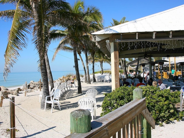 view of home's community with a water view and a gazebo