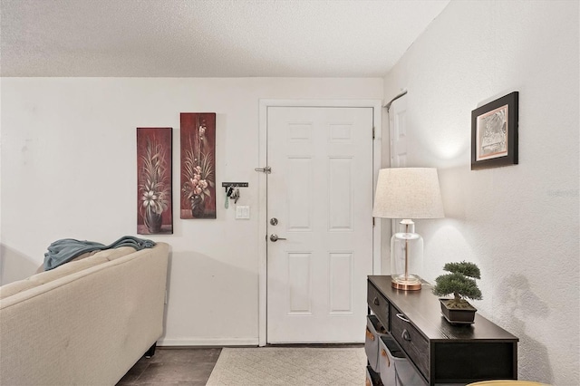 foyer featuring a textured ceiling