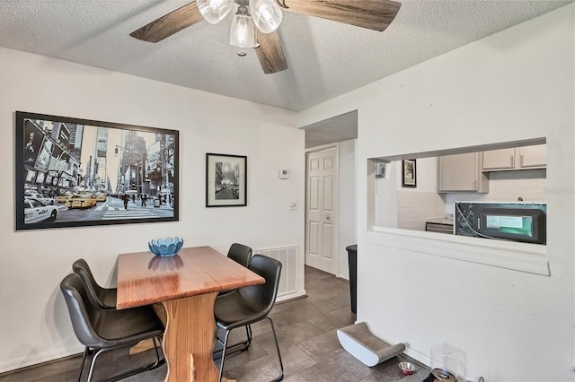 dining area with a textured ceiling