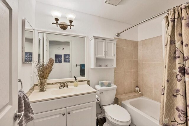 full bathroom with shower / bath combo, vanity, and toilet