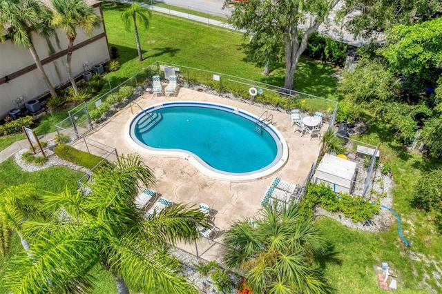 view of swimming pool featuring central AC unit and a patio