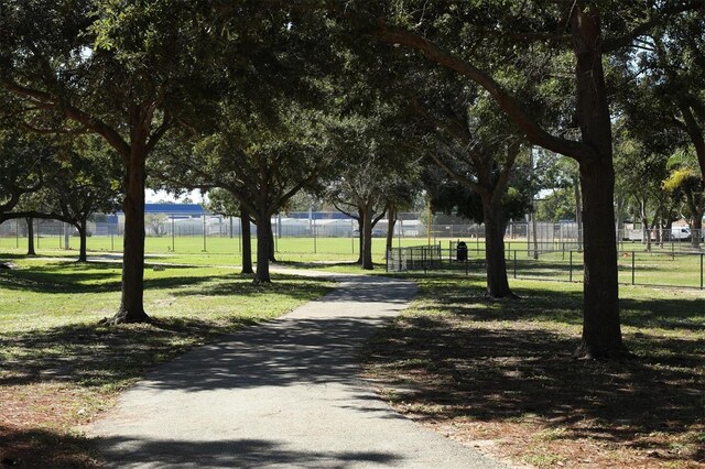 view of property's community featuring a yard