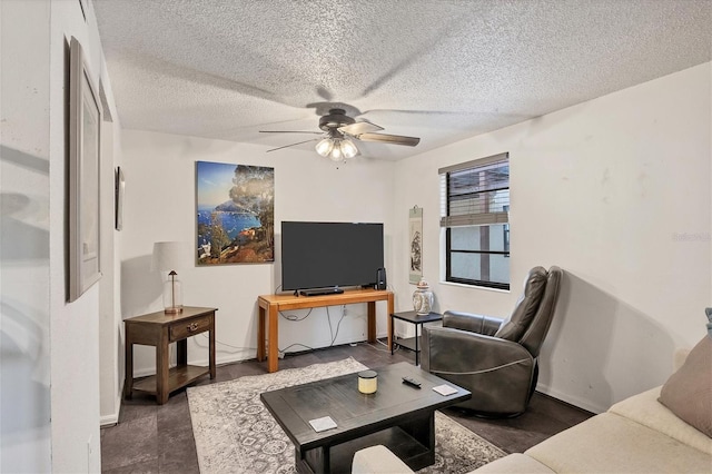 living room featuring a textured ceiling and ceiling fan