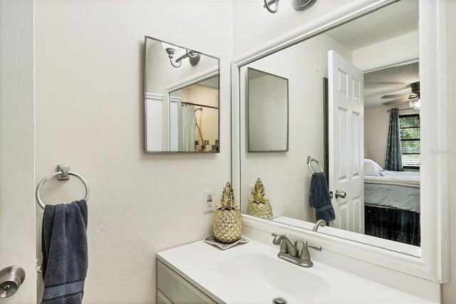 bathroom featuring vanity and ceiling fan