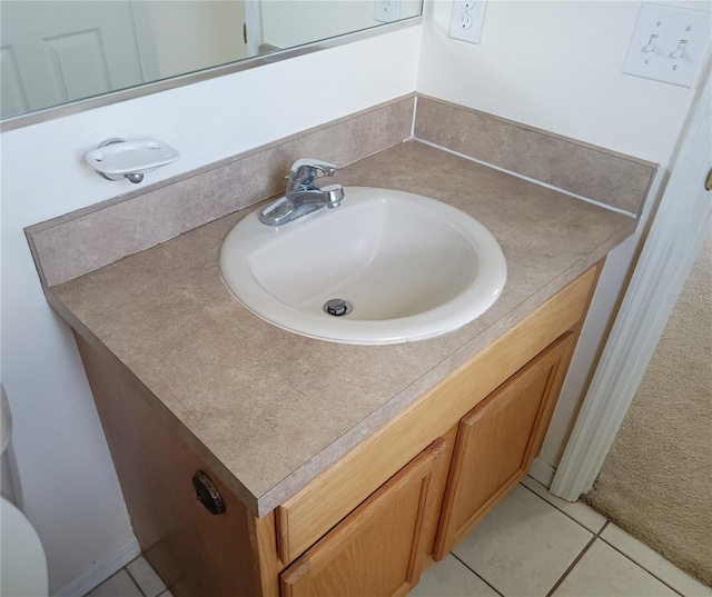 bathroom with tile patterned flooring and vanity