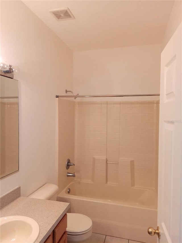 bathroom featuring tile patterned flooring, visible vents, toilet, bathing tub / shower combination, and vanity