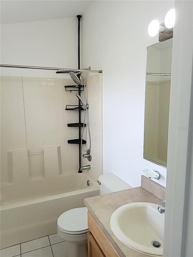 full bath with tile patterned floors, washtub / shower combination, toilet, and vanity