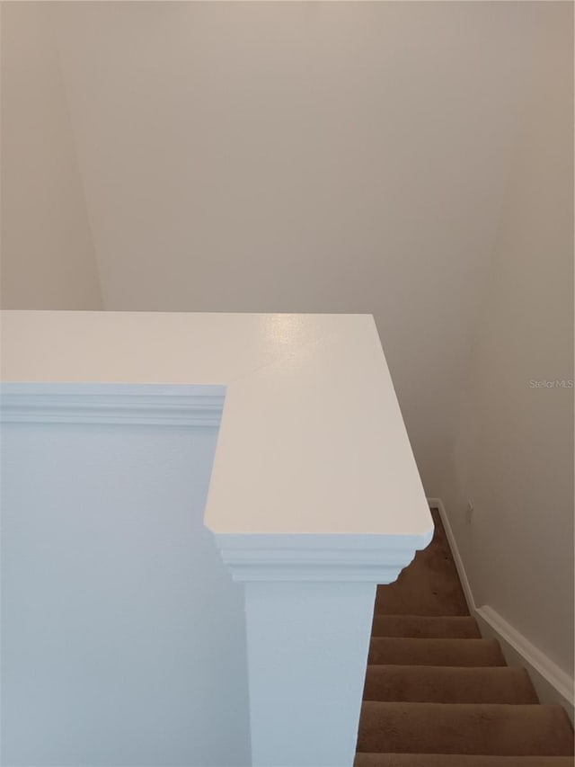 stairs featuring baseboards