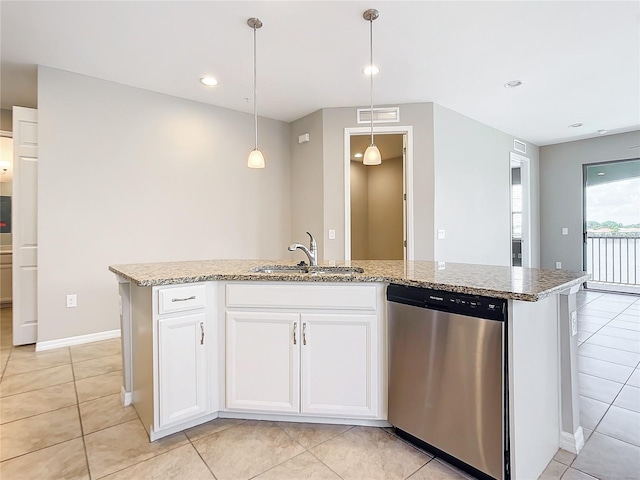 kitchen with a kitchen island with sink, stainless steel dishwasher, and light tile patterned floors