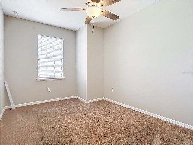 carpeted empty room with ceiling fan