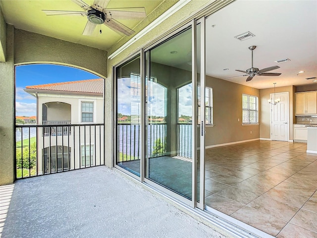 balcony featuring visible vents and ceiling fan