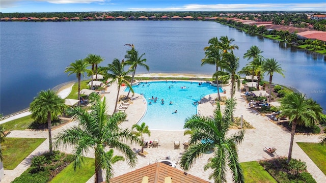 view of swimming pool featuring a water view