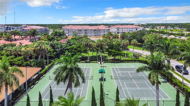 view of tennis court with fence